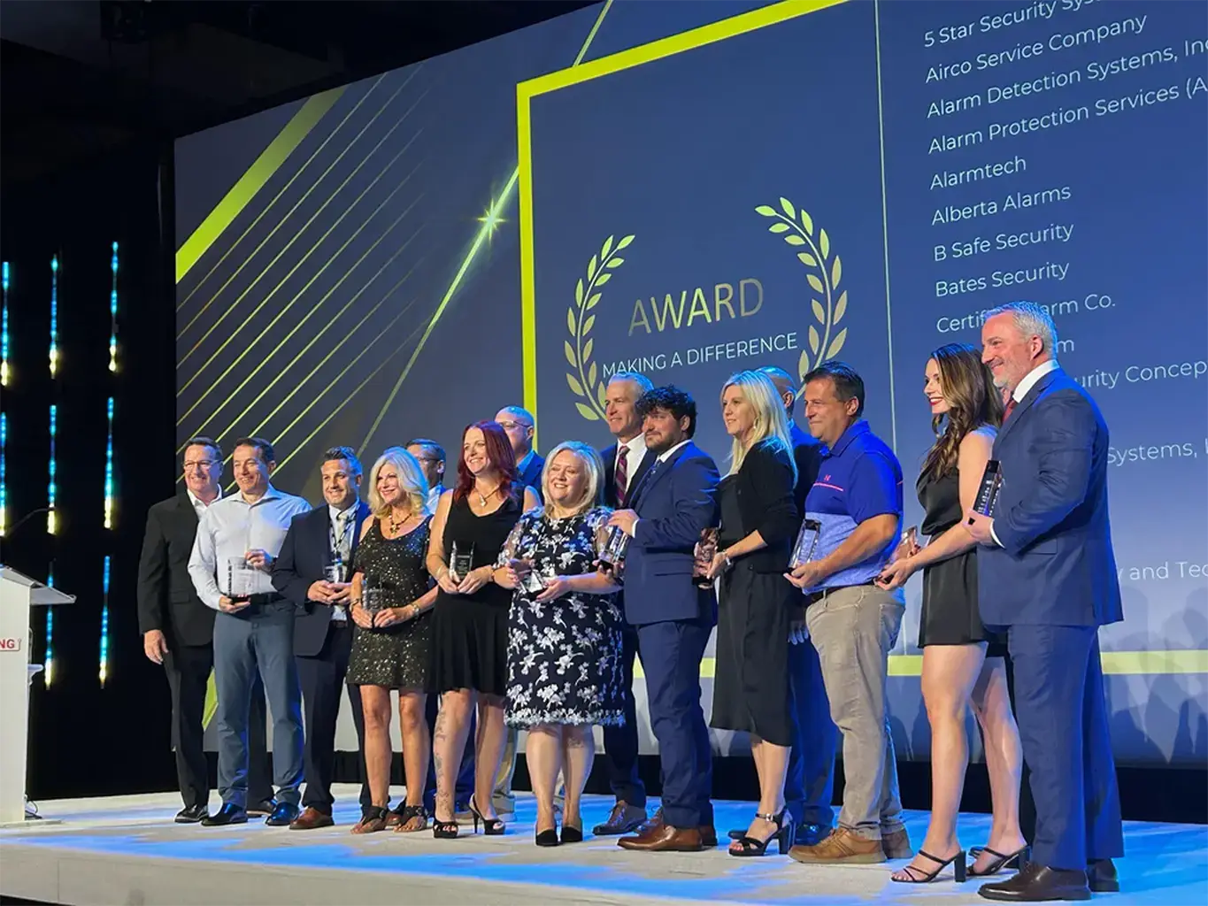 APS management team accepting the 2023 Making a Difference Award for community impact